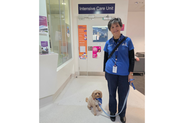 Lort Smith Pet Therapy dog Molly and owner Sophie stand outside Austin Health ICU